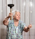 Angry old woman with a vantuz Royalty Free Stock Photo