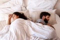 Angry people, couple and fight in bed in the morning feeling frustrated from divorce talk. Marriage problem, conflict