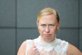 Angry petulant blond woman glaring at the camera Royalty Free Stock Photo