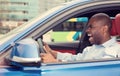 Angry off aggressive young man driving car shouting Royalty Free Stock Photo