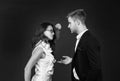 Angry professional woman clench fist at male coworker in formalwear dark background, fighting