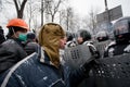 Angry protester in a military helmet arguing with