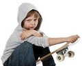 Angry rebellious girl sitting on skateboard Royalty Free Stock Photo