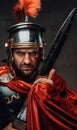 Angry roman warrior staing at camera in dark background