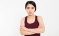 Angry sad asian girl with crossed arms on white background - Portrait of offended woman with arms crossed looking at camera