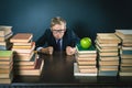 Angry schoolboy in stress or depression at school classroom Royalty Free Stock Photo