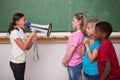 Angry schoolgirl screaming through a megaphone
