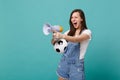 Angry screaming girl football fan support favorite team with soccer ball megaphone pointing finger aside isolated on Royalty Free Stock Photo