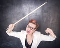 Angry screaming teacher with pointer on blackboard background Royalty Free Stock Photo