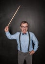 Angry screaming teacher with pointer on blackboard chalkboard Royalty Free Stock Photo