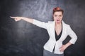 Angry screaming teacher pointing out on blackboard background Royalty Free Stock Photo
