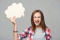Angry screaming teen girl holding thinking bubble Royalty Free Stock Photo
