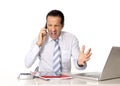 Angry senior businessman in stress working and talking on mobile phone angry Royalty Free Stock Photo