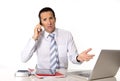 Angry senior businessman in stress working and talking on mobile phone desperate and worried Royalty Free Stock Photo