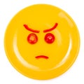 Angry smiley face made on plate Royalty Free Stock Photo