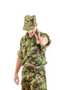 Angry soldier with hidden face in green camouflage uniform and h