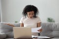 Angry stressed african girl reading bad news in mail letter Royalty Free Stock Photo