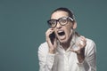 Angry businesswoman shouting on the phone Royalty Free Stock Photo
