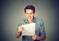 Angry stressed screaming business man with documents papers paperwork Royalty Free Stock Photo