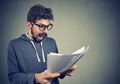 Angry stressed screaming man looking at documents papers Royalty Free Stock Photo