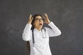 Angry stressed young doctor shouting tired of her difficult job and work problems Royalty Free Stock Photo