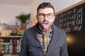 Angry teacher sticking tongue out Royalty Free Stock Photo