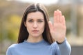 Angry teen gesturing stop in a park Royalty Free Stock Photo