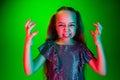 Portrait of angry teen girl over green studio background Royalty Free Stock Photo