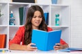 Angry teenager girl, upset and unhappy negative emotion. Back to school. Teenager school girl reading book ready to Royalty Free Stock Photo