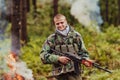 Angry terrorist militant guerrilla soldier warrior in forest