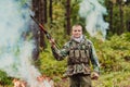 Angry terrorist militant guerrilla soldier warrior in forest