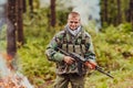 Angry terrorist militant guerrilla soldier warrior in forest