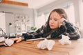 angry and tired child girl having problems with home work, throwing papers with mistakes Royalty Free Stock Photo