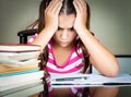 Angry and tired schoolgirl studying Royalty Free Stock Photo