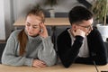 Angry unhappy young couple ignoring not looking at each other after family fight or quarrel, upset thoughtful spouses