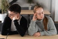 Angry unhappy young couple ignoring not looking at each other after family fight or quarrel, upset thoughtful spouses