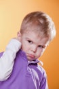 Angry upset little boy showing fist