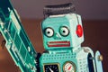 Tin toy robot carries computer circuit board, artificial intelligence concept