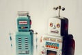 Angry vintage tin toy robots, artificial intelligence, robotic delivery concept Royalty Free Stock Photo