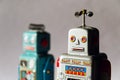 Angry vintage tin toy robots, artificial intelligence, robotic delivery concept Royalty Free Stock Photo