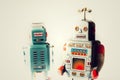 Angry vintage tin toy robots, artificial intelligence, robotic delivery concept Royalty Free Stock Photo