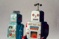 Angry vintage tin toy robots, artificial intelligence, robotic delivery concept Royalty Free Stock Photo