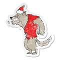 angry werewolf hand drawn distressed sticker cartoon of a wearing santa hat