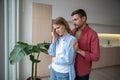 Angry wife turning back to apologizing husband, demonstrating unwilingness to hear, listen, speak Royalty Free Stock Photo