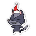 angry wolf sticker cartoon of a wearing santa hat