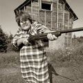 Angry woman with big gun Royalty Free Stock Photo