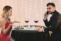 Angry Woman Blaming Her Boyfriend Talking On Phone During Romantic Dinner