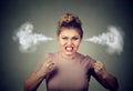 Angry woman blowing steam coming out of ears about to have nervous breakdown screaming Royalty Free Stock Photo