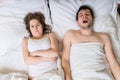 Angry woman cant sleep and listening her husband snoring