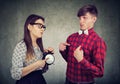 Angry woman confronts her boyfriend who is late Royalty Free Stock Photo